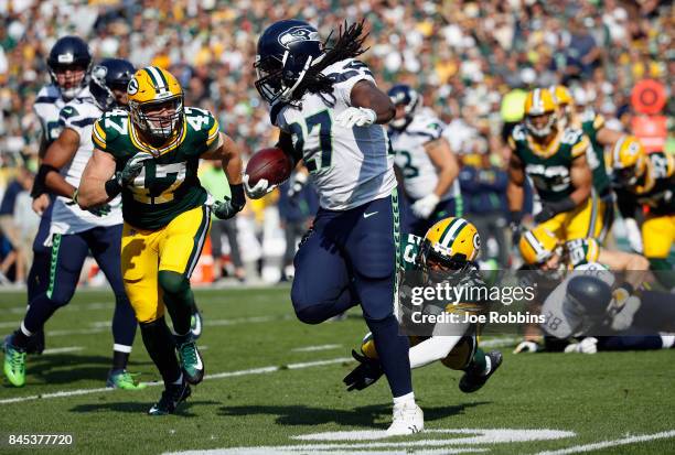 Damarious Randall of the Green Bay Packers attempts to tackle Eddie Lacy of the Seattle Seahawks during the first half at Lambeau Field on September...