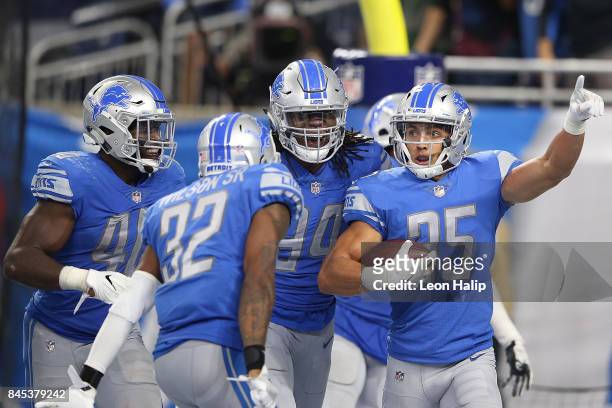 Miles Killebrew of the Detroit Lions celebrates a touchdown with teammates in the game against the Arizona Cardinals at Ford Field on September 10,...