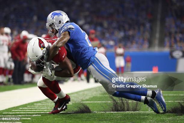 David Johnson of the Arizona Cardinals is tackled by Darius Slay of the Detroit Lions after a first half catch at Ford Field on September 10, 2017 in...