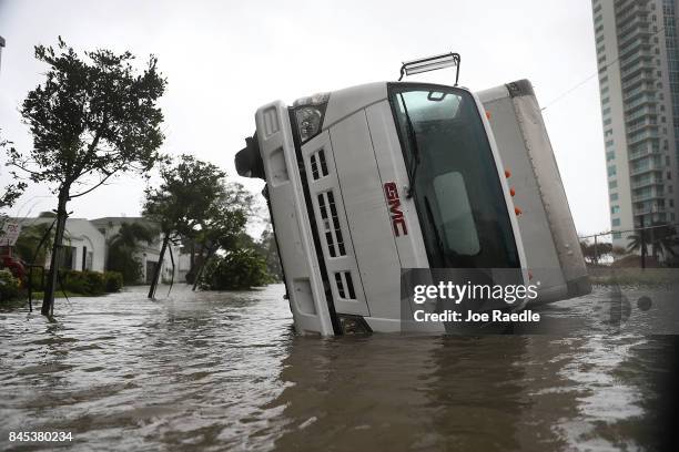 Truck is seen on its side after being blown over as Hurricane Irma passed through on September 10, 2017 in Miami, Florida. Hurricane Irma, which...