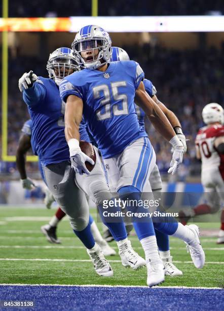 Miles Killebrew of the Detroit Lions celebrates a fourth quarter touchdown after he intercepts a pass while playing the Arizona Cardinals at Ford...