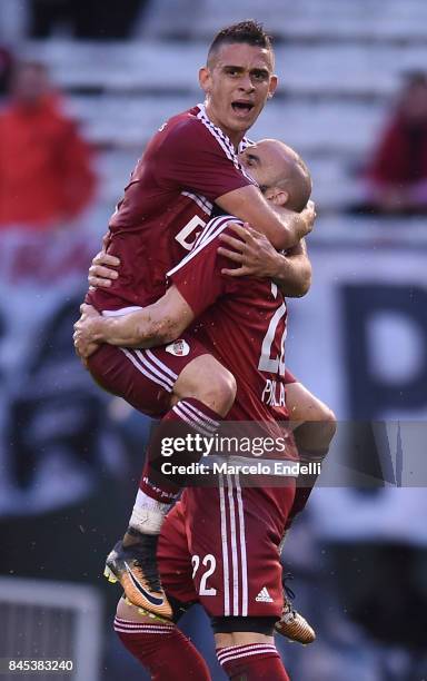 Javier Pinola of River Plate celebrates with teammate Rafael Santos Borre after scoring the first goal of his team during a match between River Plate...