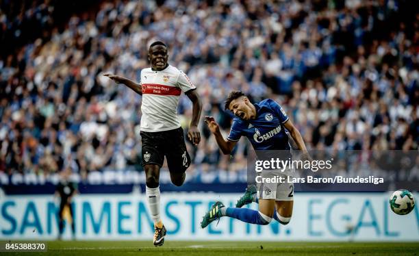 Orel Mangala of Stuttgart challenges Amine Harit of Schalke during the Bundesliga match between FC Schalke 04 and VfB Stuttgart at Veltins-Arena on...