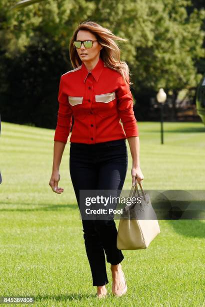 First Lady Melanie Trump walks from Marine One upon arrival on the South Lawn of the White House in Washington, DC, September 10 after spending the...