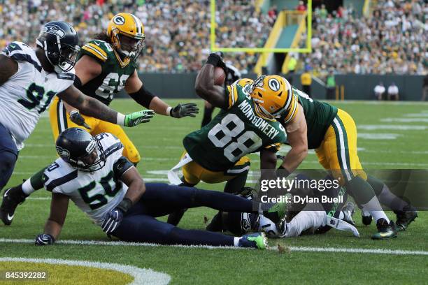 Ty Montgomery of the Green Bay Packers scores a 6-yard rushing touchdown during the third quarter against the Seattle Seahawks at Lambeau Field on...