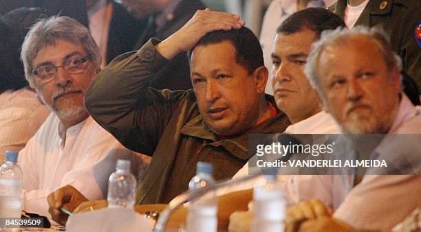 Venezuelan President Hugo Chavez , flanked by his counterparts from Paraguay Fernando Lugo and Ecuador's Rafael Correa , speaks during a meeting with...