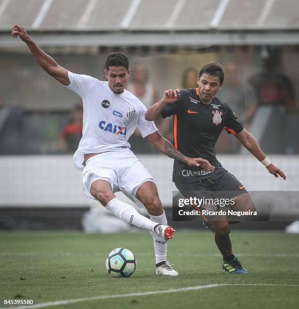 Lucas Verissimo of Santos battles for the ball with Romero of Corinthians during the match between Santos and Corinthians as a part of Campeonato...