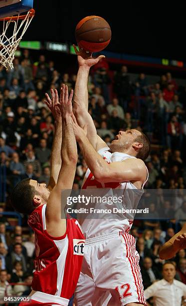 Richard Mason Rocca, #12 of AJ Milano in action with Panagiotis Vasilopoulos, #13 of Olympiacos during the Euroleague Basketball Top 16 Game 1 match...