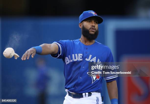 Richard Urena of the Toronto Blue Jays tosses the rosin bag against the Detroit Tigers at Rogers Centre on September 9, 2017 in Toronto, Canada.