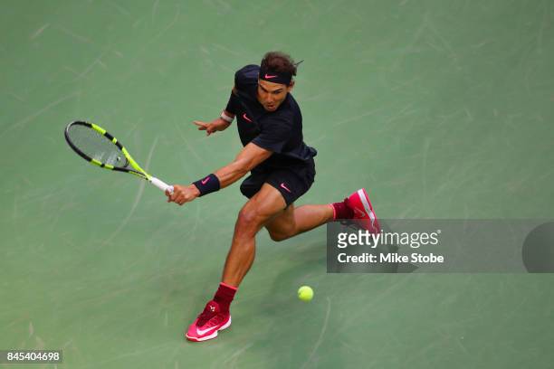 Rafael Nadal of Spain returns a shot against Kevin Anderson of South Africa during their Men's Singles finals match on Day Fourteen during the 2017...