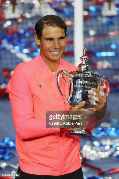 Rafael Nadal of Spain poses with the championship trophy during the trophy ceremony after he defeated Kevin Anderson of South Africa in the Men's...