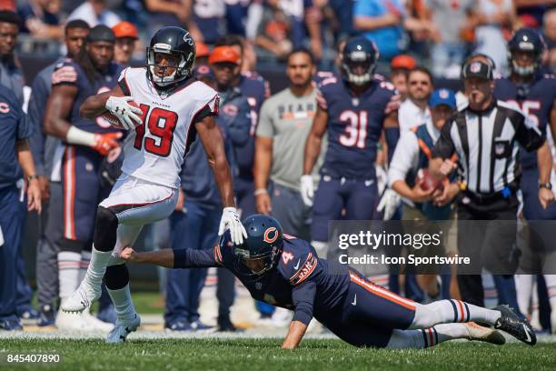 Chicago Bears kicker Connor Barth attempts to tackle Atlanta Falcons wide receiver Andre Roberts during an NFL football game between the Atlanta...