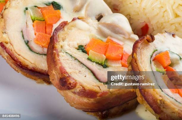 rolls of chicken meat - cooked turkey white plate stock pictures, royalty-free photos & images
