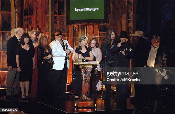 Billy Powell, Gary Rossington, Bob Burns, Artimus Pyle and Ed King of Lynyrd Skynyrd, inductees, with family members including Judy Van Zant , widow...