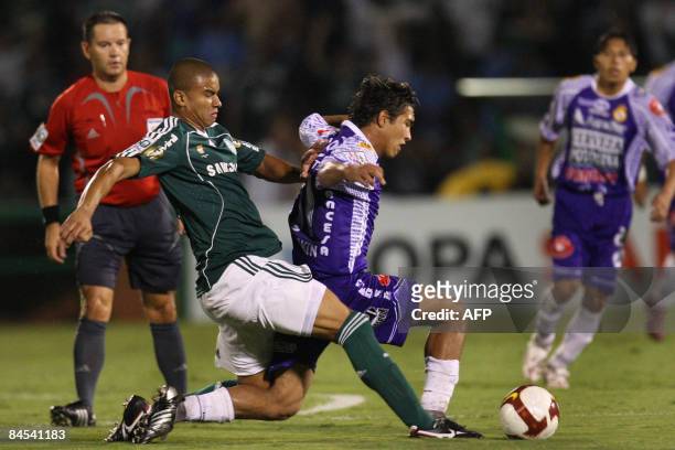 Mauricio Ramos of Palmeiras vies for the ball with Gerardo Yeserotte of Bolivia's Real Potosi during their Libertadores Cup football match at...