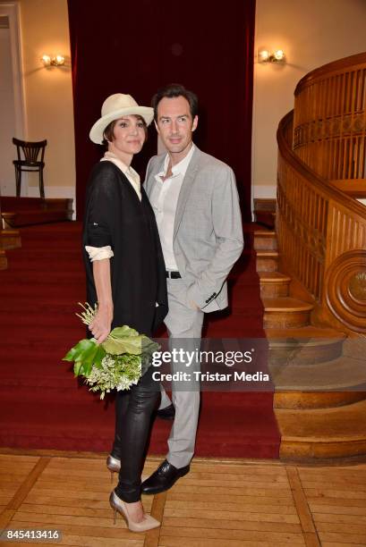 Anouschka Renzi and Arne Stephan attend the premiere of 'Die Kameliendame' at Schlosspark Thetaer on September 10, 2017 in Berlin, Germany.