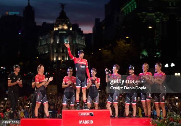 Alberto Contador waves with members of his Trek team after Stage 21 of the Vuelta a Espana race on September 10, 2017 in Madrid, Spain.