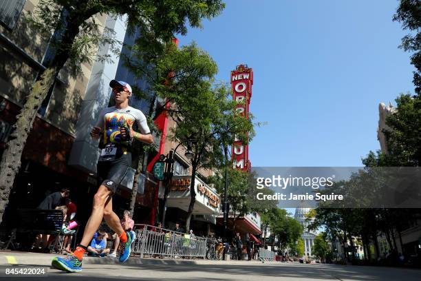 Competitor runs down State Street during the Marathon portion of the Ironman Madison on September 10, 2017 in Madison, Wisconsin.