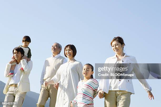 multi-generation family taking a walk - japanese girls hot fotografías e imágenes de stock