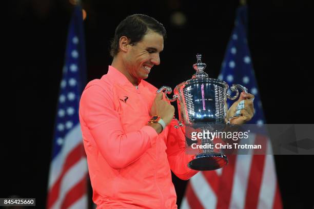 Rafael Nadal of Spain poses with the championship trophy during the trophy ceremony after defeating Kevin Anderson of South Africa during their Men's...