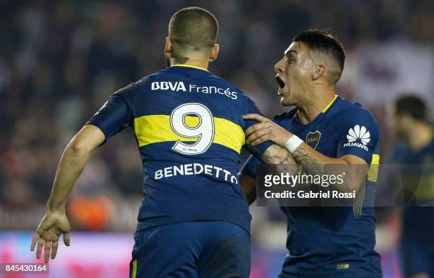 Dario Benedetto of Boca Juniors celebrates with teammates after scoring the first goal of his team during a match between Lanus and Boca Juniors as...
