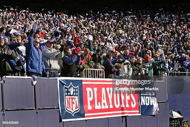 New York Giants fans cheer during the NFC Divisional Playoff game against the Philadelphia Eagles on January 11, 2009 at Giants Stadium in East...