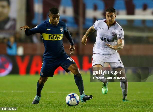 Wilmar Barrios of Boca Juniors fights for the ball with German Denis of Lanus during a match between Lanus and Boca Juniors as part of the Superliga...