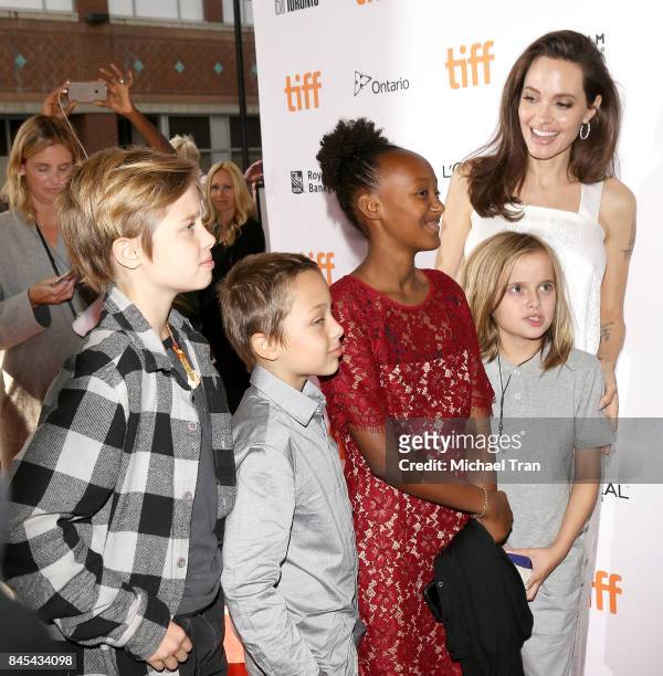 Angelina Jolie with her children arrive to the "The Breadwinner" premiere - 2017 TIFF - Premieres, Photo Calls and Press Conferences held on...