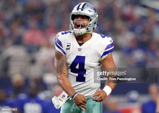 Dak Prescott of the Dallas Cowboys celebrates after throwing a touchdown pass to Jason Witten of the Dallas Cowboys in the second quarter against the...