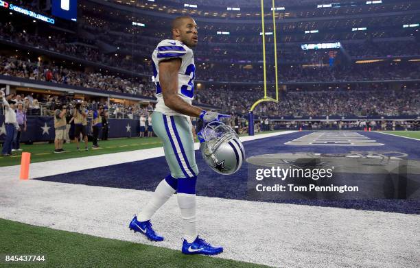 Orlando Scandrick of the Dallas Cowboys walks to the locker room after being injured on a play against the New York Giants in the first half at AT&T...