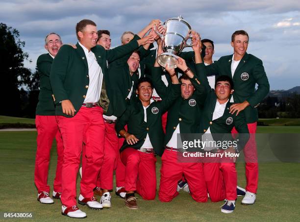 Team USA pose with the Walker Cup after beating Great Britain and Ireland 19-7 during the 2017 Walker Cup at the Los Angeles Country Club on...