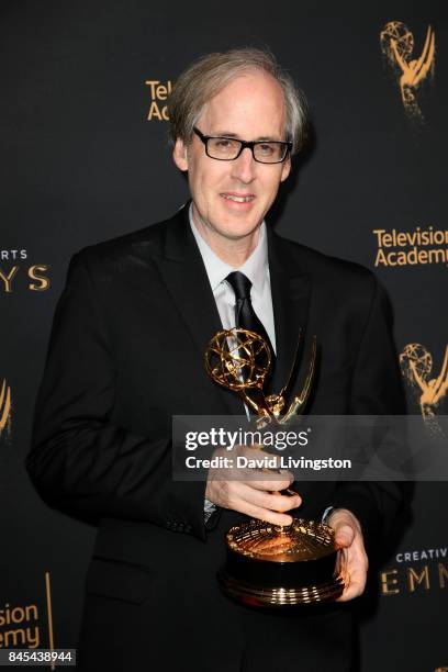 Jeff Beal poses in the press room with the award for outstanding music composition for a series for "House of Cards" at the 2017 Creative Arts Emmy...