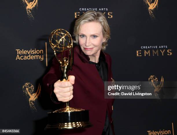 Jane Lynch poses in the press room with the the award for outstanding actress in a short form comedy series for "Dropping the Soap" at the 2017...