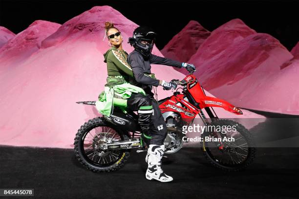 Rihanna rides a dirtbike on the runway at the FENTY PUMA by Rihanna Spring/Summer 2018 Collection at Park Avenue Armory on September 10, 2017 in New...