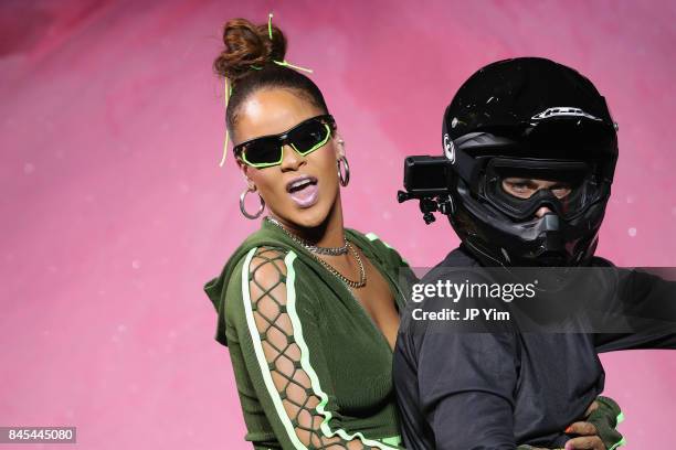 Rihanna rides a dirtbike on the runway at the FENTY PUMA by Rihanna Spring/Summer 2018 Collection at Park Avenue Armory on September 10, 2017 in New...