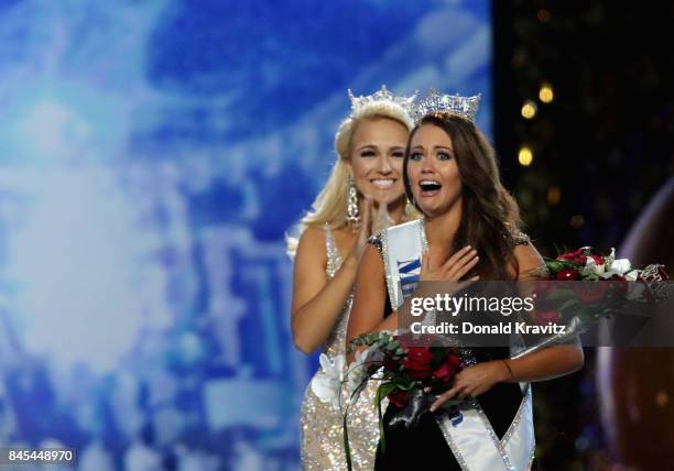 Miss North Dakota 2017 Cara Mund is crowned as Miss America 2018 by Miss America 2017 Savvy Shields during the 2018 Miss America Competition Show at...