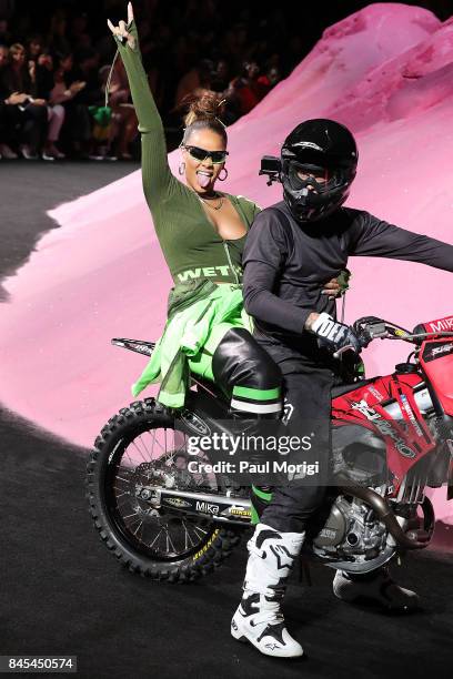 Rihanna waves from the back of a motorcycle at the finale of the Fenty Puma by Rihanna show during New York Fashion Week at the 69th Regiment Armory...