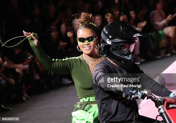 Rihanna waves from the back of a motorcycle at the finale of the Fenty Puma by Rihanna show during New York Fashion Week at the 69th Regiment Armory...