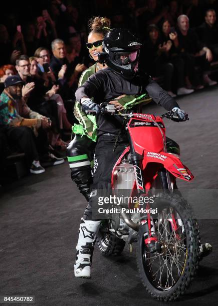 Rihanna on the back of a motorcycle at the finale of the Fenty Puma by Rihanna show during New York Fashion Week at the 69th Regiment Armory on...