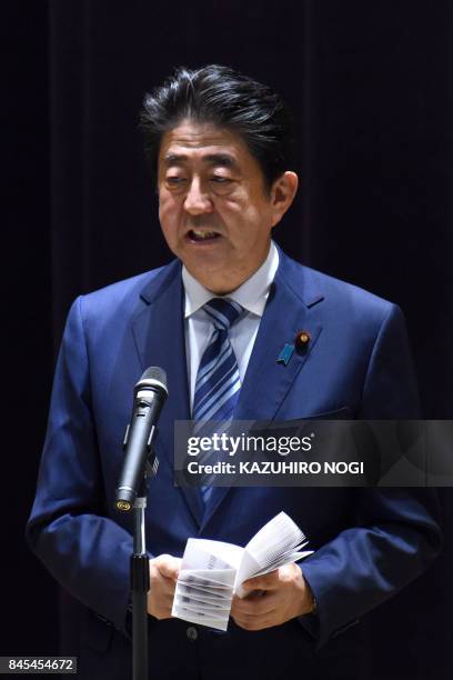 Japan's Prime Minister Shinzo Abe delivers a speech at a gathering of Self-Defence Force senior officers at the Defence Ministry in Tokyo on...