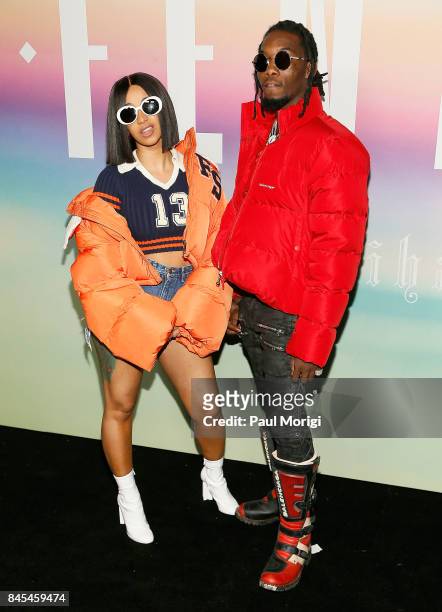 Rappers Cardi B and Offset of Migos attend the Fenty Puma by Rihanna show during New York Fashion Week at the 69th Regiment Armory on September 10,...