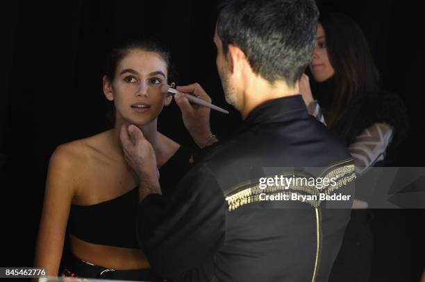 Kaia Gerber prepares backstage at the FENTY PUMA by Rihanna Spring/Summer 2018 Collection at Park Avenue Armory on September 10, 2017 in New York...