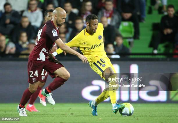 Neymar Jr of PSG and Renaud Cohade of FC Metz during the French Ligue 1 match between FC Metz and Paris Saint Germain at Stade Saint-Symphorien on...