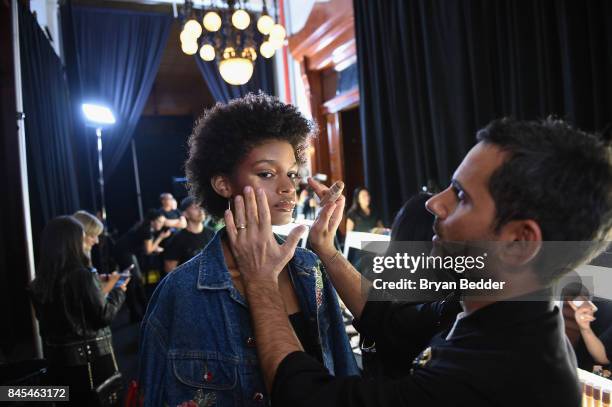 Model has her makeup done with Fenty Beauty products backstage at the FENTY PUMA by Rihanna Spring/Summer 2018 Collection at Park Avenue Armory on...