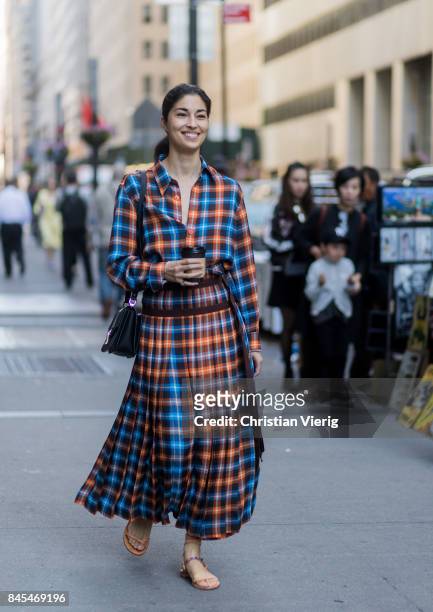 Caroline Issa wearing a checked dress seen in the streets of Manhattan outside Victoria Beckham during New York Fashion Week on September 10, 2017 in...