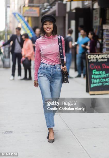 Aimee Song wearing pink longshirt, flat cap seen in the streets of Manhattan outside Sies Marjan during New York Fashion Week on September 10, 2017...