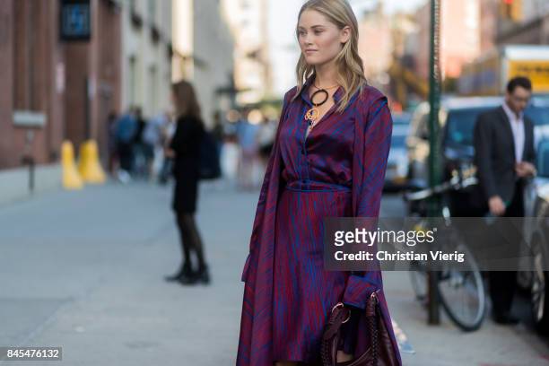 Virginia Gardner wearing a purple dress seen in the streets of Manhattan outside Diane von Furstenberg during New York Fashion Week on September 10,...