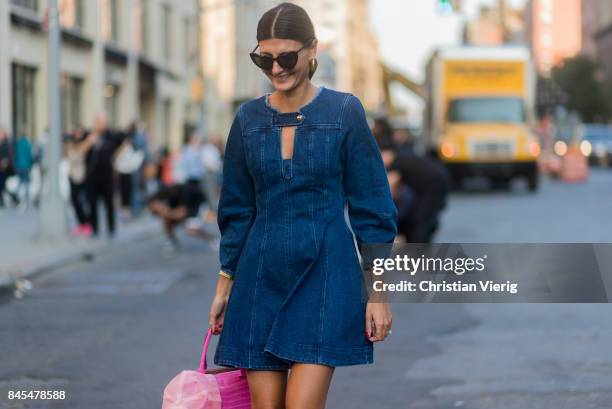 Giovanna Engelbert wearing denim dress, pink heels and bag seen in the streets of Manhattan outside Diane von Furstenberg during New York Fashion...