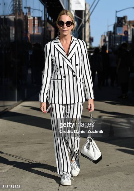 A guest is seen wearing a Chanel black and white striped suit with a  Fotografía de noticias - Getty Images