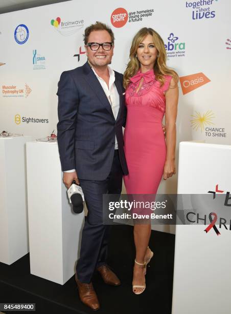 Alan Carr and Elizabeth Hurley, representing Walking With The Wounded/Wounded Veterans Fund, attends BGC Charity Day on September 11, 2017 in London,...
